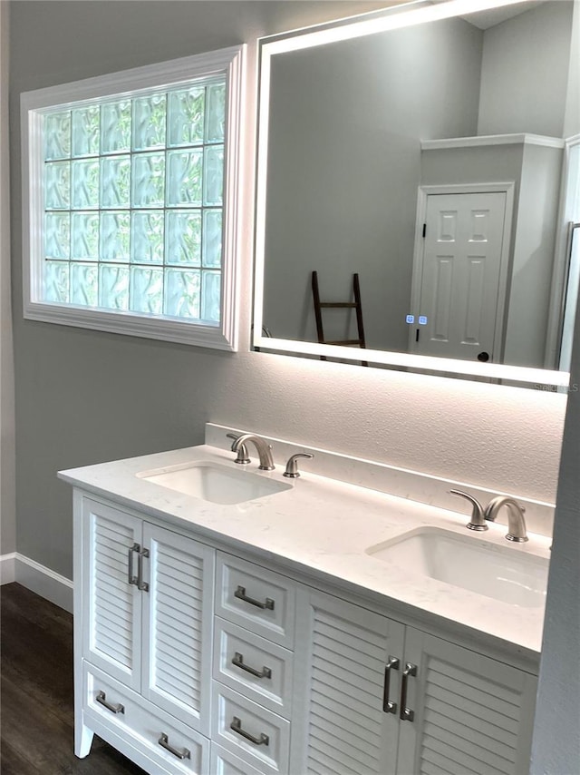 bathroom featuring vanity and hardwood / wood-style floors