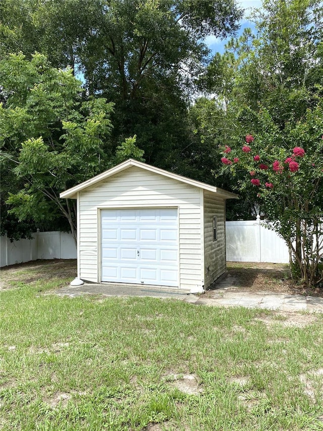 garage featuring a lawn