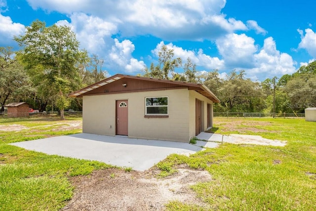 garage featuring a yard