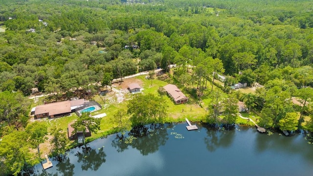 bird's eye view with a water view and a wooded view