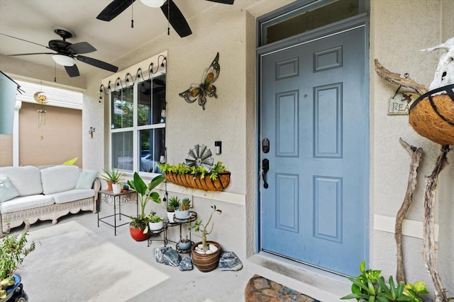 property entrance with ceiling fan