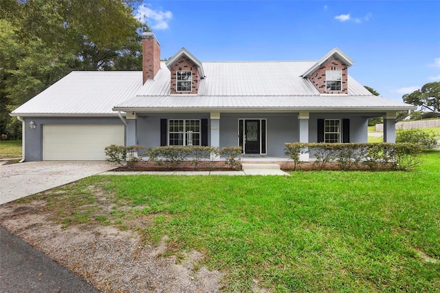 view of front facade featuring covered porch, a garage, and a front lawn