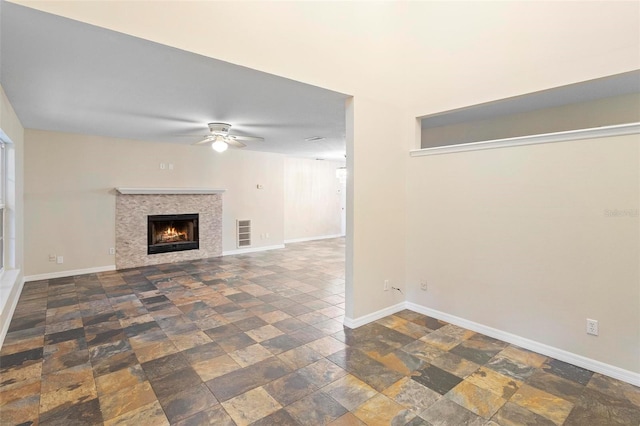 unfurnished living room featuring ceiling fan