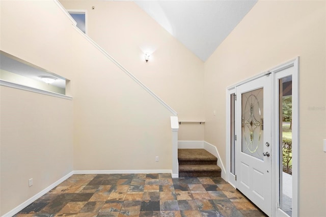 entryway featuring lofted ceiling