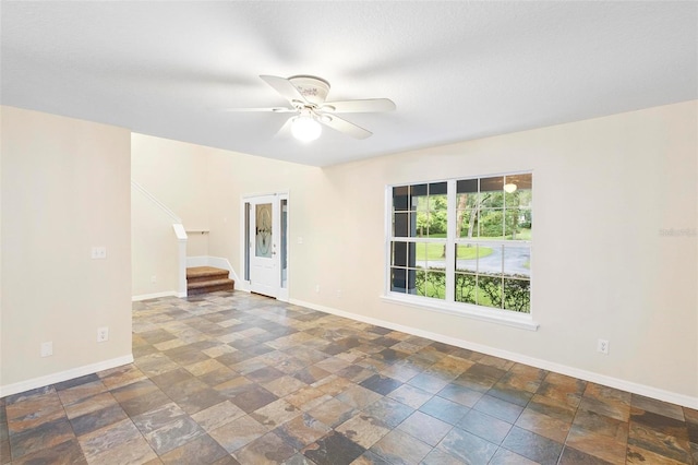 empty room featuring ceiling fan