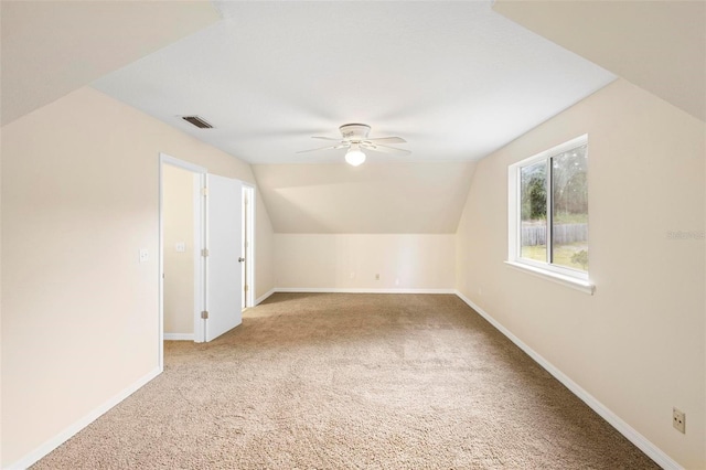 bonus room with light carpet, ceiling fan, and lofted ceiling