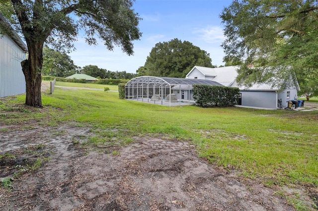 view of yard with a lanai