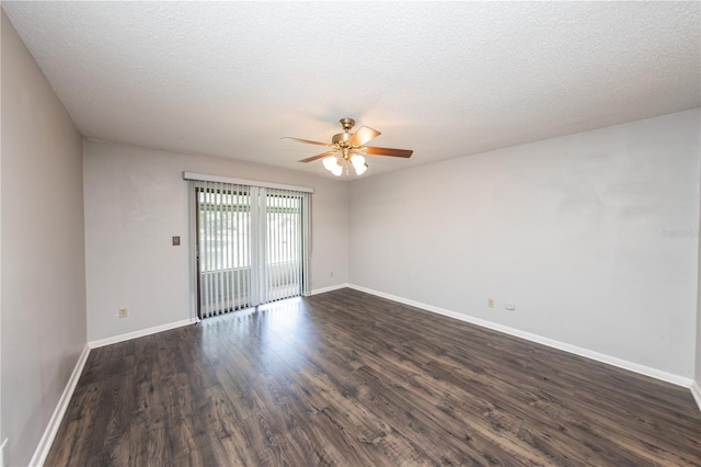 empty room featuring dark hardwood / wood-style flooring, a textured ceiling, and ceiling fan