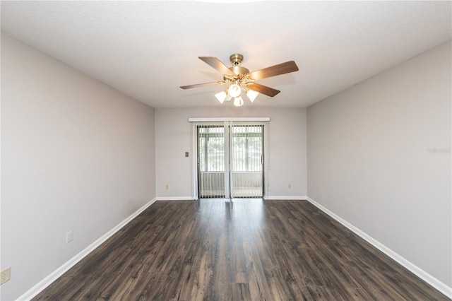 unfurnished room with dark hardwood / wood-style flooring and ceiling fan