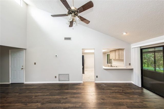 unfurnished living room featuring sink, dark hardwood / wood-style floors, a textured ceiling, and ceiling fan