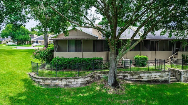 34 Fairway Dr Unit 1, Debary, FL 32713 - rear view of house with a sunroom, stucco siding, and stairway