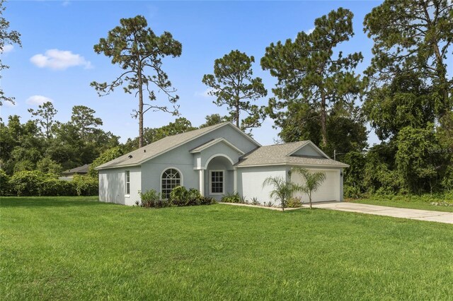 ranch-style home featuring a garage and a front yard