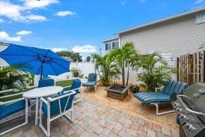 view of patio featuring a grill