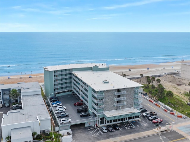 bird's eye view with a water view and a view of the beach