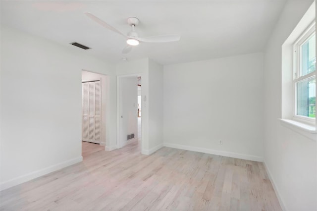 spare room with light hardwood / wood-style floors and ceiling fan