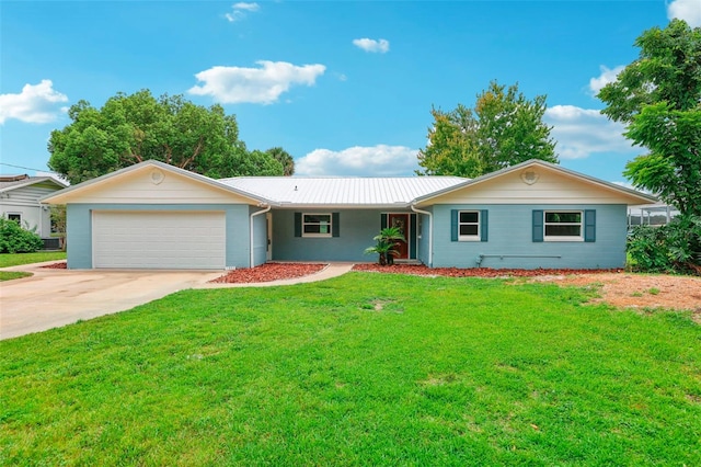 ranch-style home with a front yard and a garage