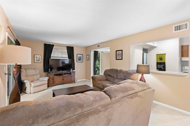 living room featuring light carpet