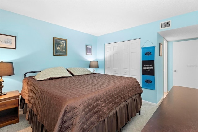 carpeted bedroom with a closet