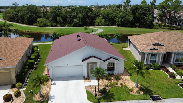 birds eye view of property with a water view