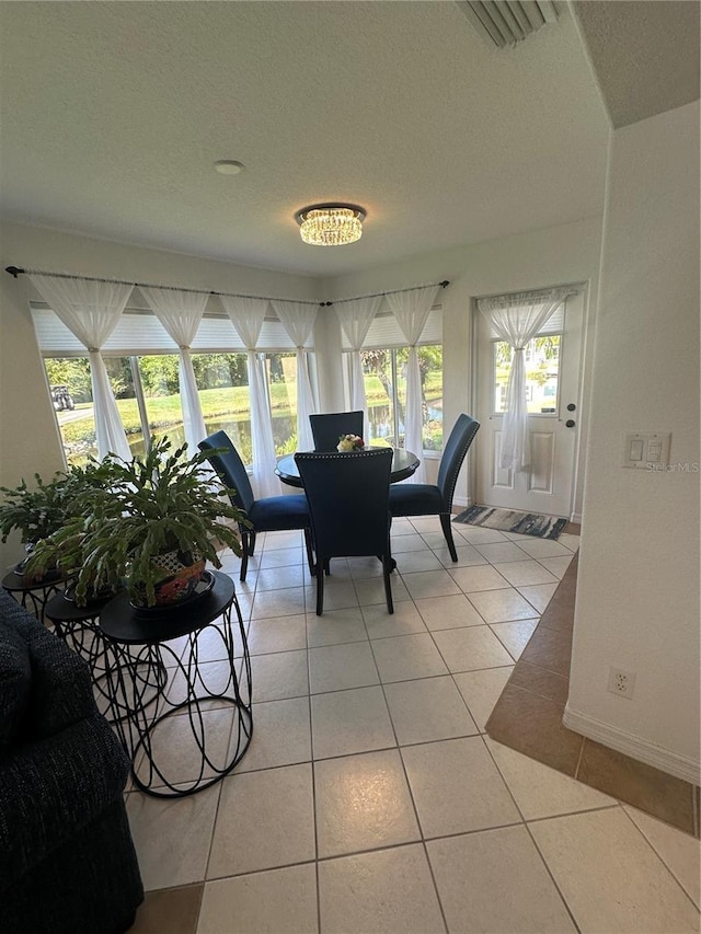 tiled dining area with a wealth of natural light