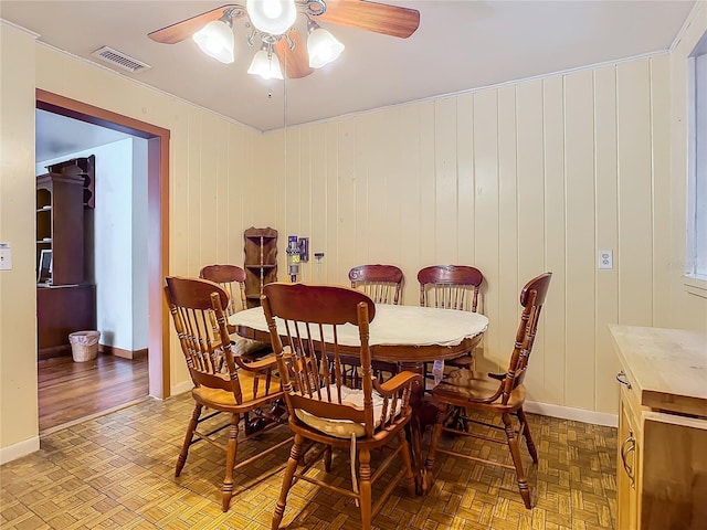 dining area featuring parquet floors and ceiling fan