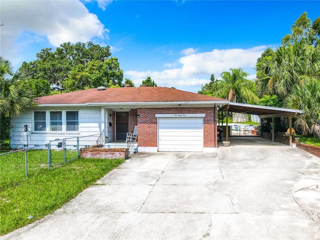 single story home featuring a garage, a carport, and a front yard