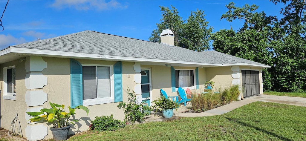 view of front of home with a front yard and covered porch