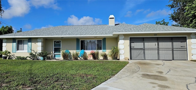 ranch-style home featuring a garage and a front lawn