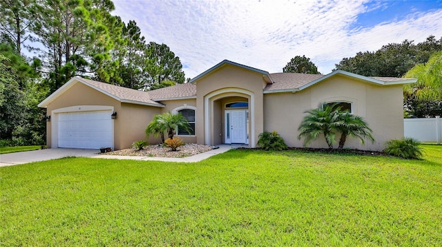 ranch-style house featuring a garage and a front lawn