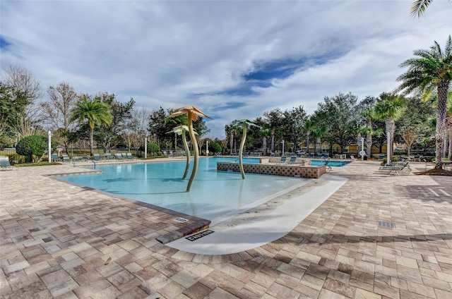 view of swimming pool with a patio area