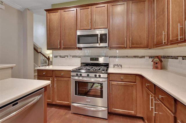 kitchen with wood-type flooring, decorative backsplash, and stainless steel appliances