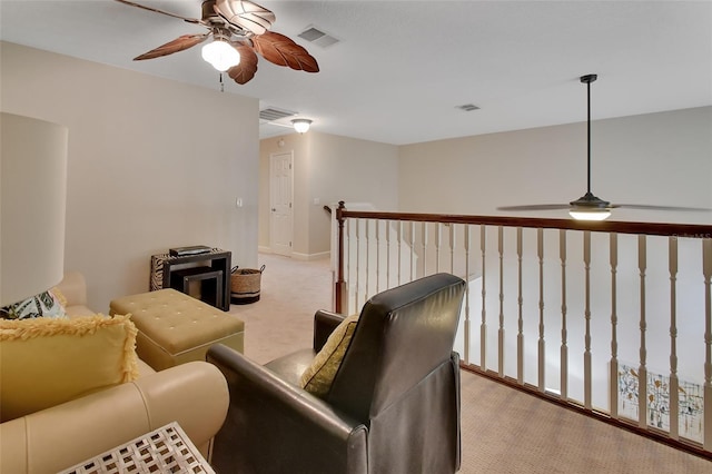 living room with ceiling fan and light colored carpet