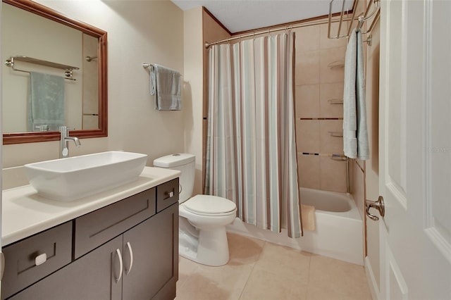 full bathroom featuring shower / tub combo with curtain, vanity, tile patterned floors, and toilet