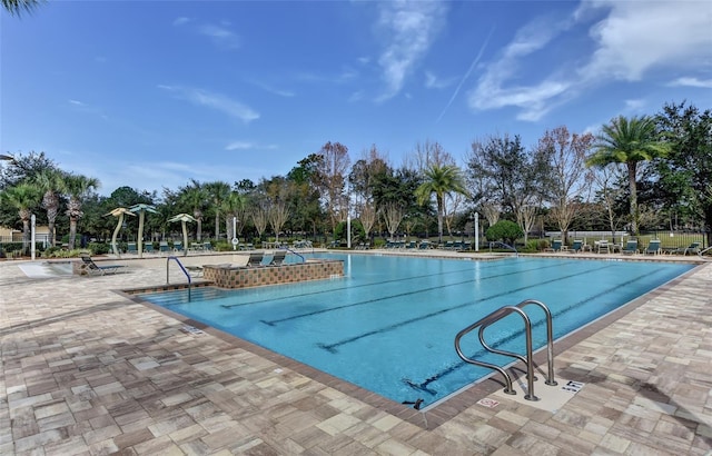 view of swimming pool with a patio area