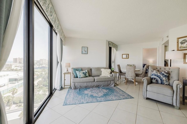 living room featuring light tile patterned floors and a textured ceiling