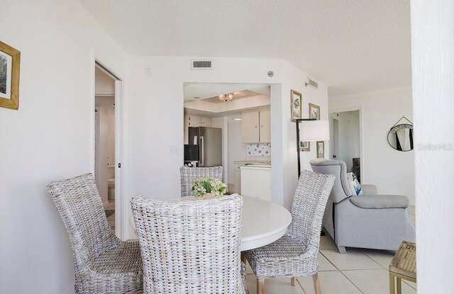 dining room with light tile patterned flooring and washer / dryer