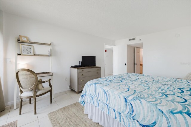 bedroom with light tile patterned flooring