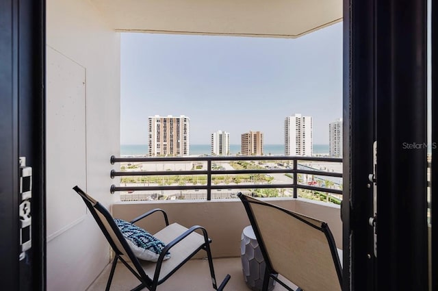 balcony featuring a water view