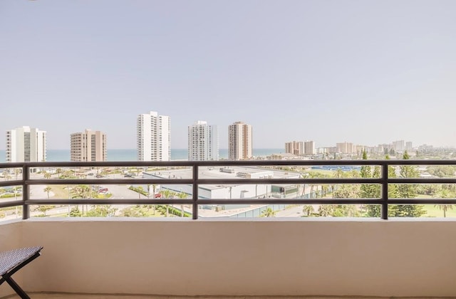 balcony featuring a water view