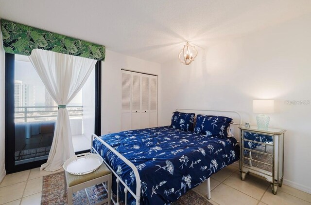 tiled bedroom with a closet