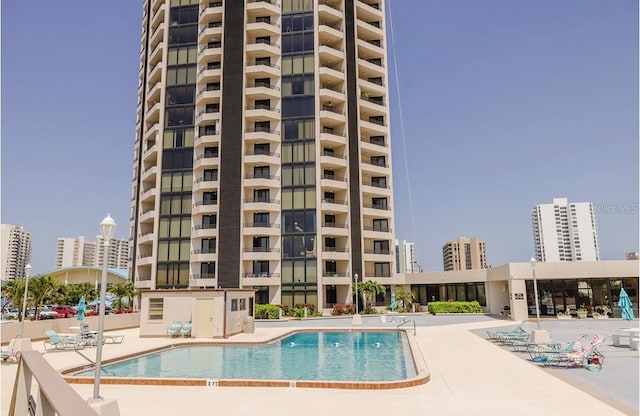 view of swimming pool with a patio