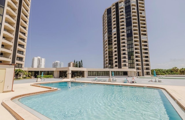 view of pool featuring a patio area