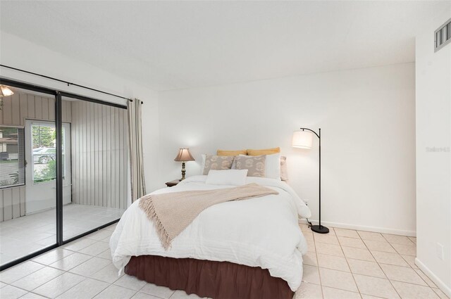 bedroom with light tile patterned floors