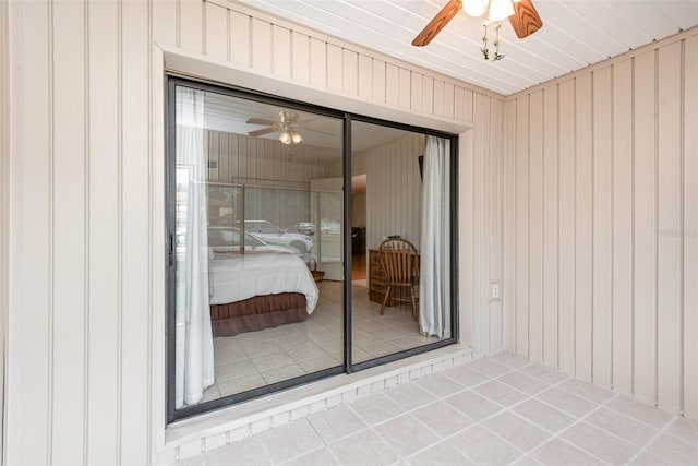 exterior space with ceiling fan