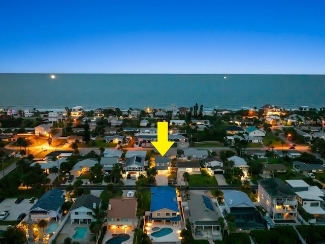 birds eye view of property featuring a water view and a residential view