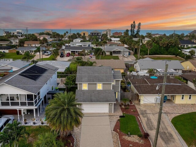 aerial view at dusk with a residential view