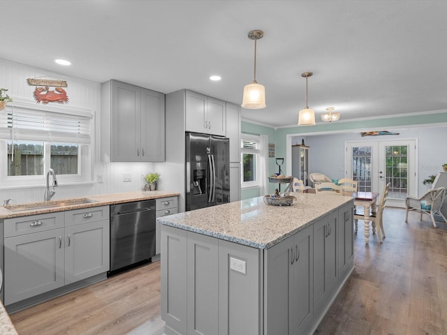 kitchen featuring black dishwasher, gray cabinetry, french doors, stainless steel refrigerator with ice dispenser, and a sink