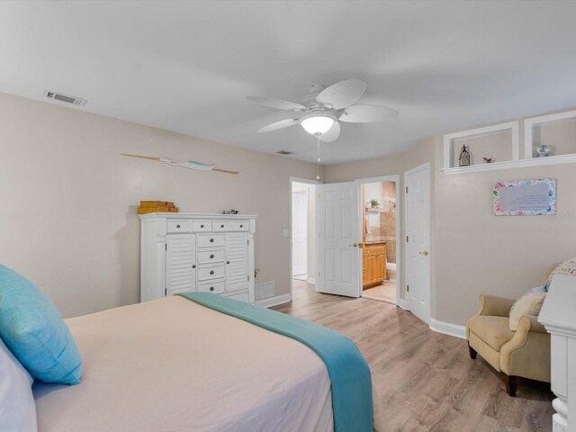 bedroom with light wood-style flooring, a ceiling fan, visible vents, and baseboards