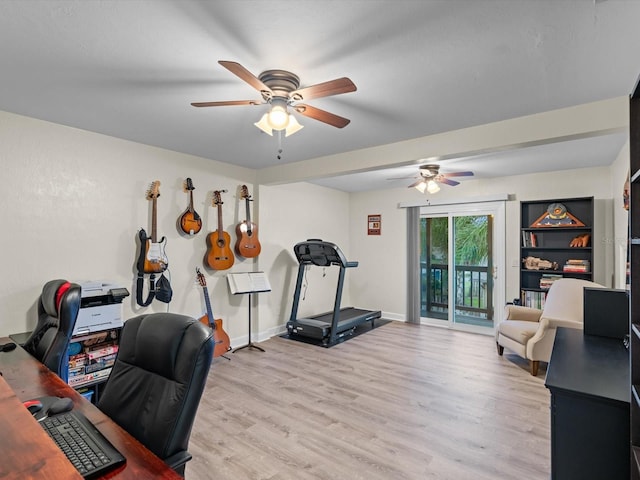 home office with a ceiling fan, baseboards, and light wood finished floors