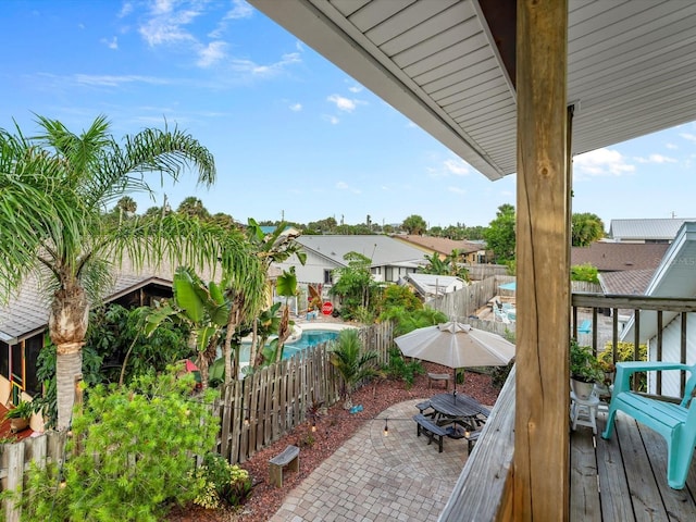 exterior space with a fenced in pool, a patio area, and fence